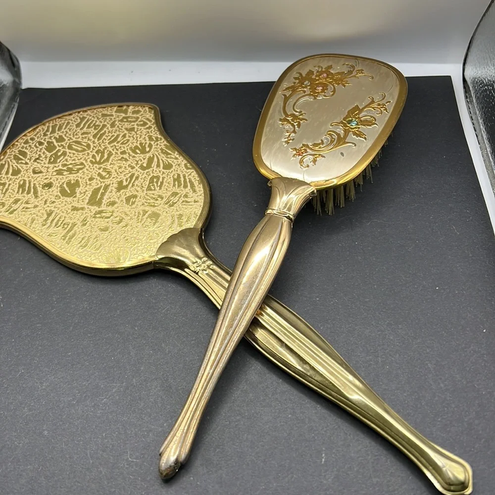 Vintage vanity hand mirror and brush